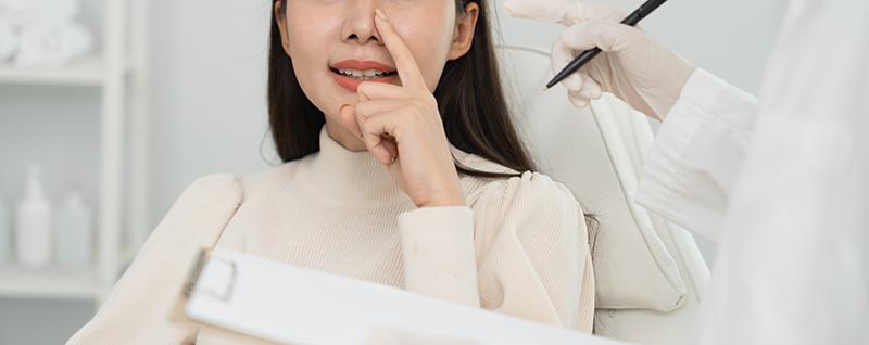 Lady at a post-rhinoplasty surgery review.